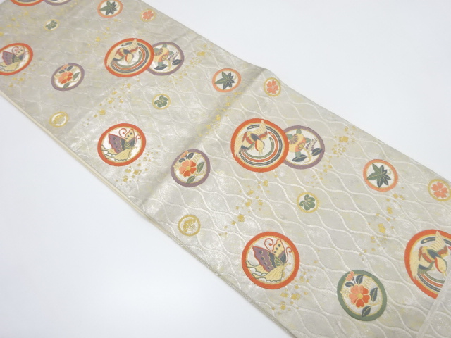 丸紋に蝶・花鳥模様織り出し袋帯